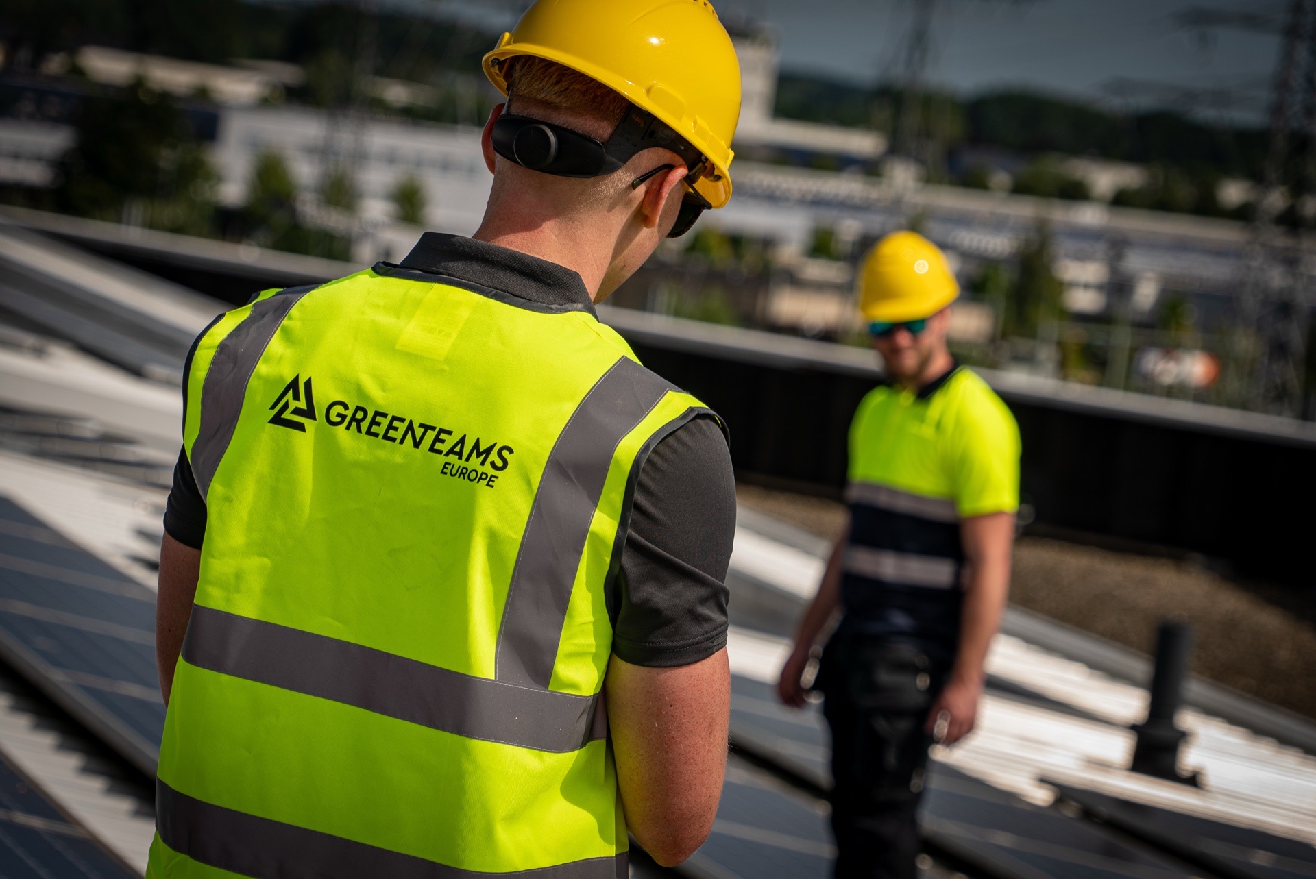 Green Teams Europe installers on a rooftop