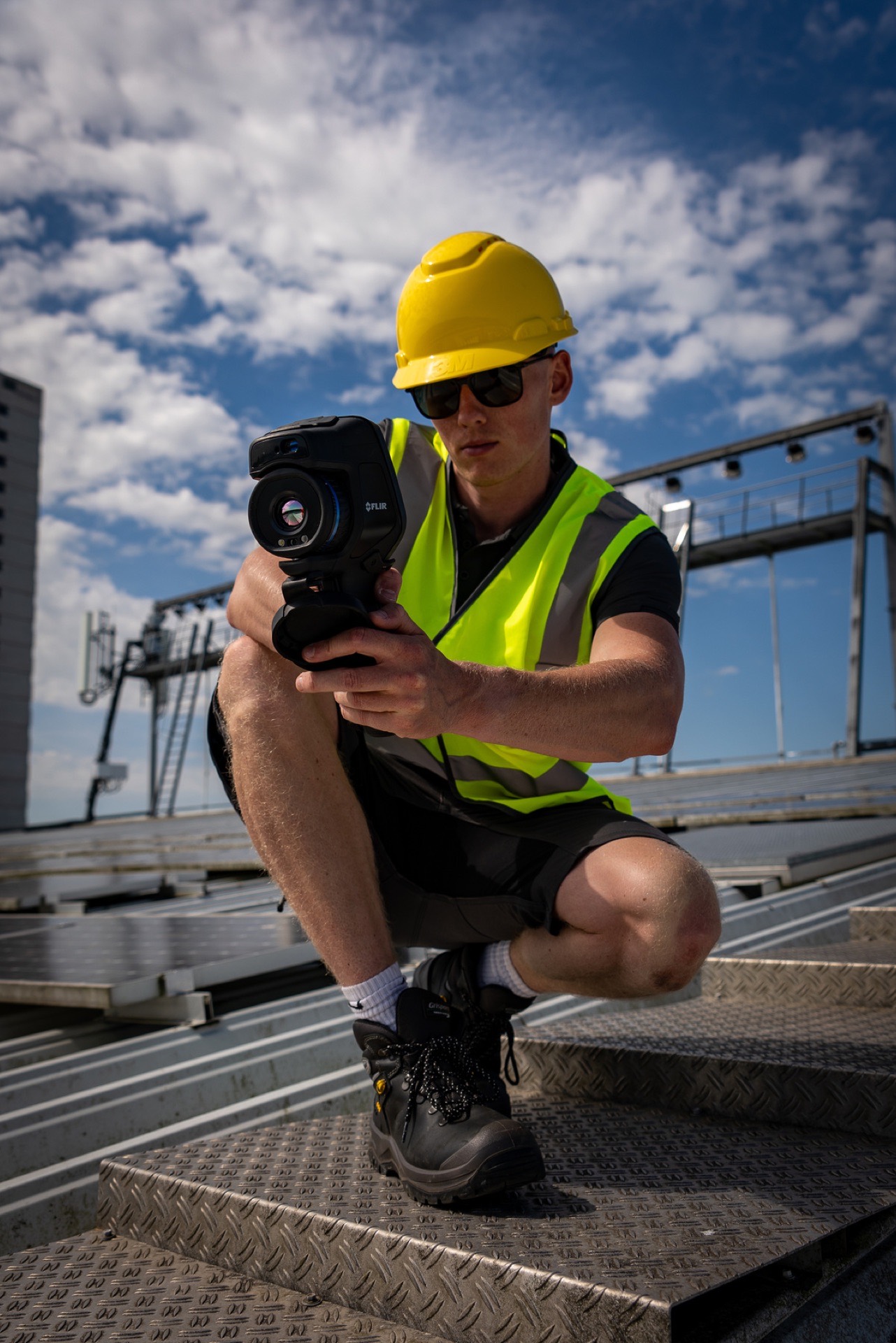 Green Teams Europe engineer reviewing a solar installation design on site