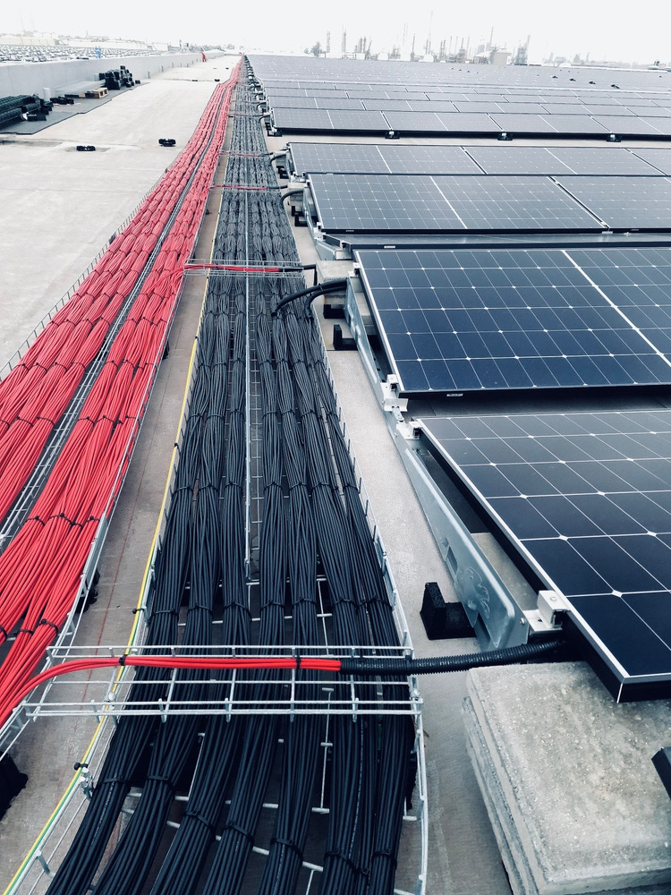 Immaculately dressed DC cable runs alongside solar panels, installed by Green Teams Europe